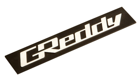 GREDDY ALUMINUM EMBLEM 60X12 BLACK / SILVER S-SIZE