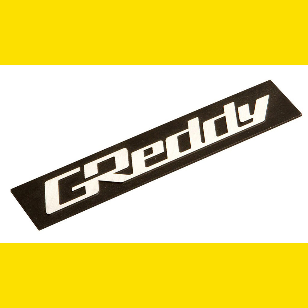 GREDDY ALUMINIUM EMBLEM 105X20 BLACK/SILVER