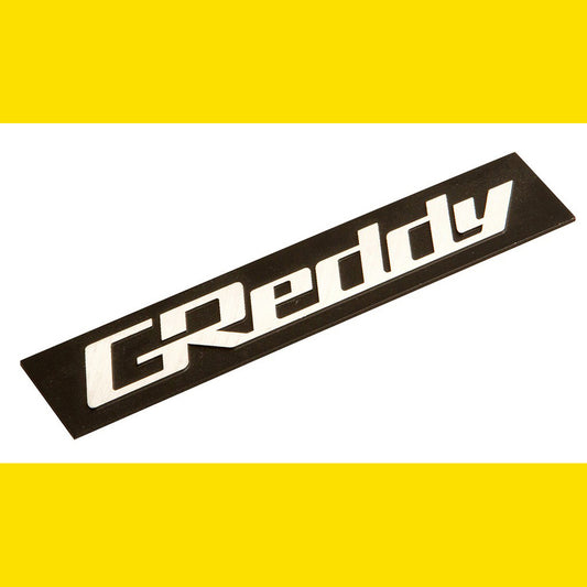 GREDDY ALUMINIUM EMBLEM 105X20 BLACK/SILVER